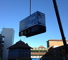 A generator being crained onto a building top and installed for a local council by Enhanced Power Services Ltd