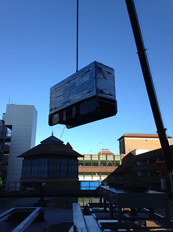 A generator being crained onto a building top and installed for a local council by Enhanced Power Services Ltd